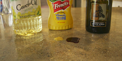 Think about what happens to a kitchen counter every day. People splash acids on it. They spill things that stain it. They chop and slice on it. They set hot pots and dishes down on it. And they clean and clean and clean it with water and chemicals and green scrub-pads